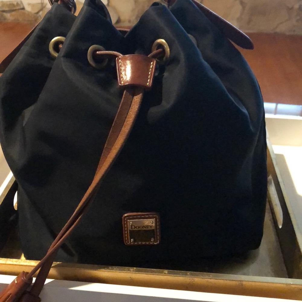 Nylon drawstring bag with leather accents